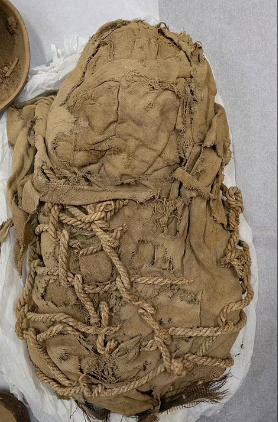The tiny skeletons, wrapped tightly in cloth, were discovered last November at the dig site of Cajamarquilla, east of the capital Lima