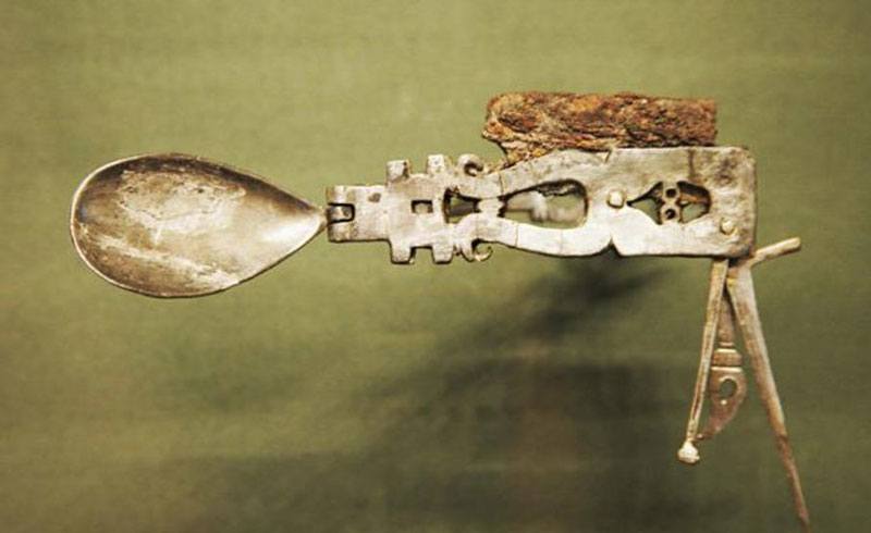 Roman Legion silver pocket knife. Invented by the Romans in 200 A.D. It  combined an iron blade, spoon, fork, toothpick, a little hook, and a little  poker that was probably used to