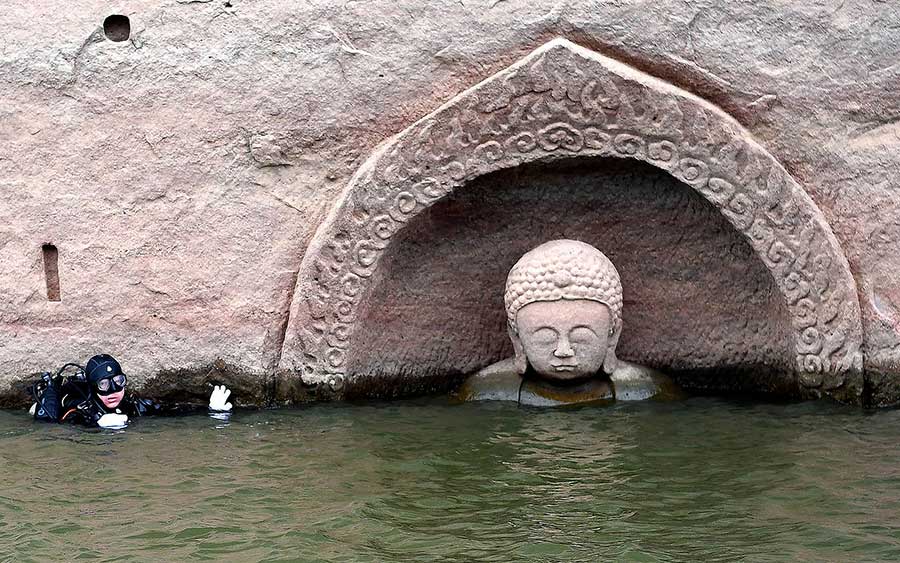 Ancient Buddha found as water level of reservoir lowers in E China[1]- Chinadaily.com.cn