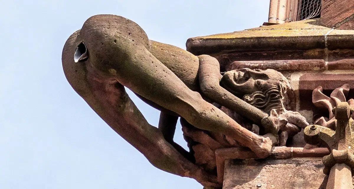 The mooning gargoyle of Freiburg minster. Legend has it that a disgruntled  stonemason created this gargoyle and positioned in the the direction of the  city council building. Council members had commissioned him