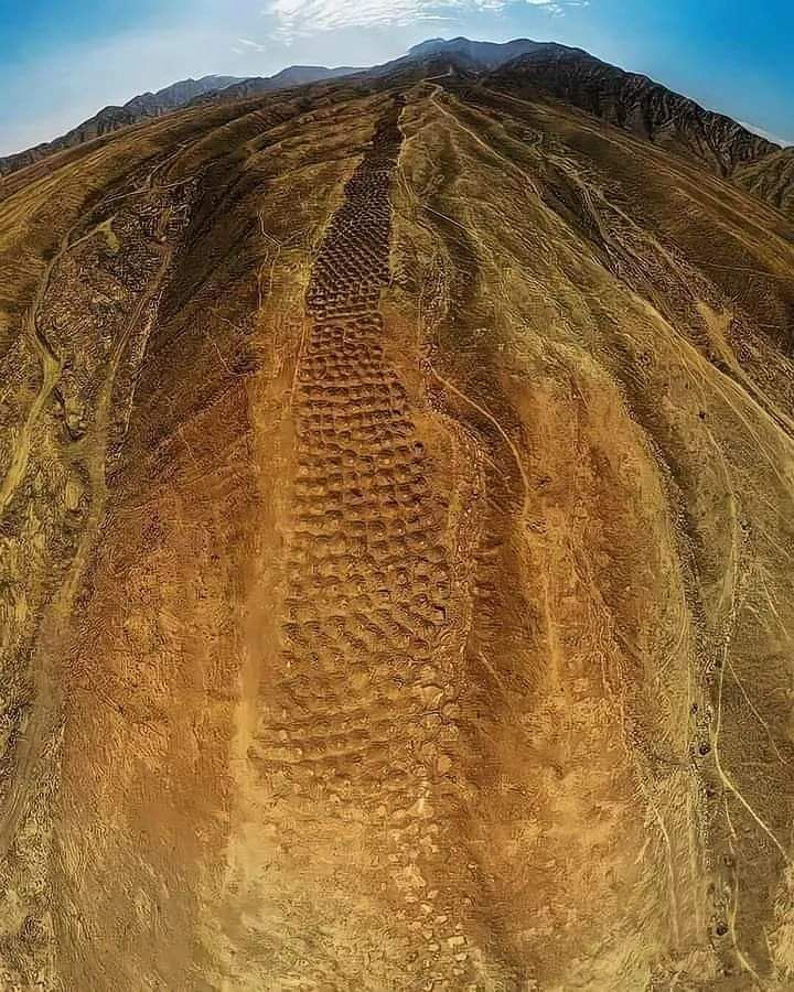 The Mysterious 'Band of Holes' in the Peruvian Mountains In the Pisco Valley on the Nazca Plateau in Peru, there's a series of over 5,00… in 2024 | Nazca, Peru, Art history