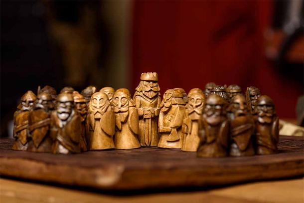 Replica carved wooden Hnefatafl board game. (Olga Makukha / Adobe Stock)