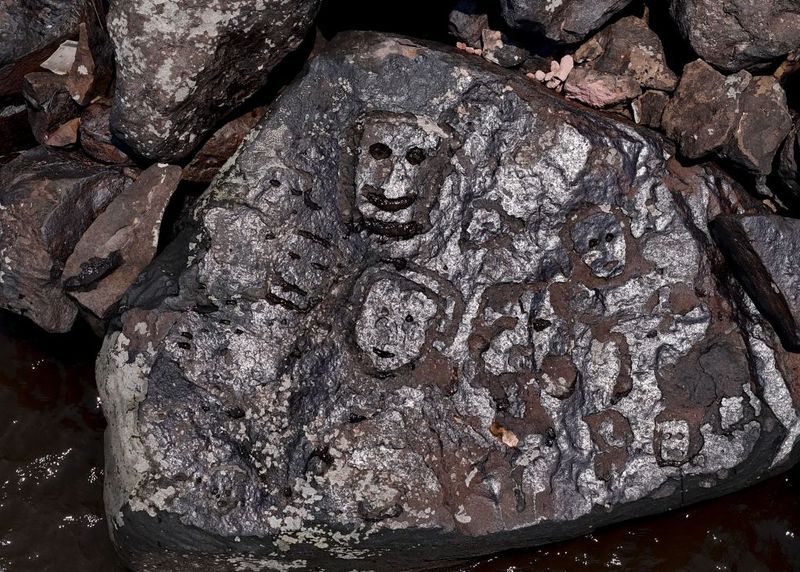 Amazon Drought Reveals Dozens Of Ancient Faces Carved In Rocks | IFLScience