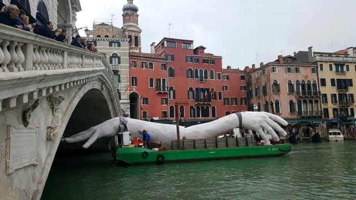 Giant Hands Rise Up from Venetian Lagoon in "Support" of Climate Change  Awareness