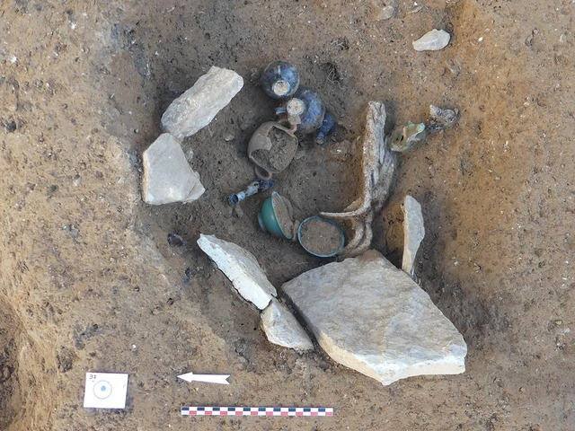 A Secondary Cremation Site Yields Stunning Finds, Including Glass Vases, Ceramics, and a Beautifully Preserved Bronze Oil Lamp