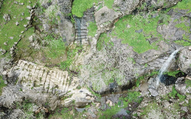 A Stunning View of the Waterfall, Staircase, and Boulevard Within the Ancient Fortress