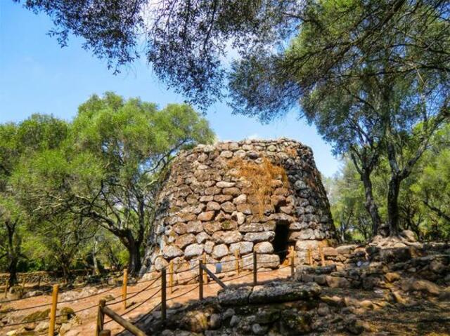 About 200 meters from the well lies the Santa Cristina Nuraghe, a single stone tower with a circular base