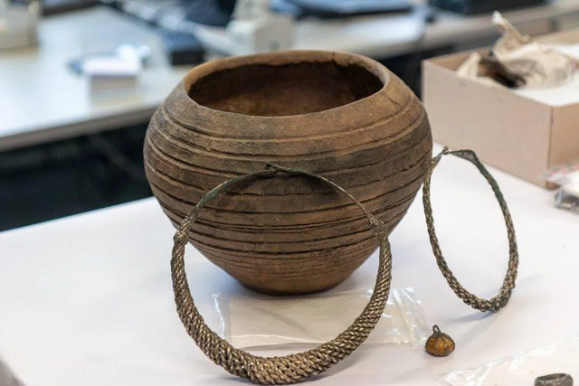 Among the discoveries were a pot containing 1,700 coins, a gold and gemstone pearl necklace, finger and neck rings, and two reliquary containers