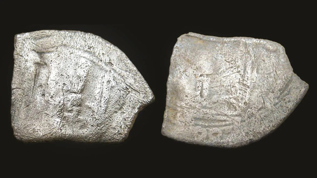 Among the treasures found was a fragment of a silver coin from Arabia, dated to between 795 and 806 CE