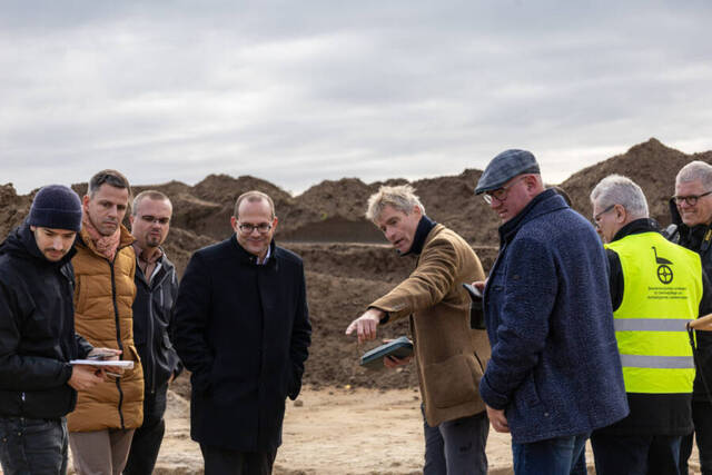 Archaeologist Immo Heske Highlights a Section of the Nordic Bronze Age Meeting Hall, Revealing Its Historical Significance