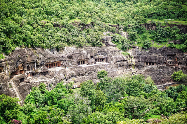 Dating back to the 2nd century BCE, the Ajanta Caves in Maharashtra are a series of rock-cut Buddhist temples carved into a horseshoe-shaped cliff