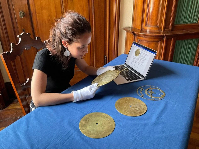 Dr. Federica Gigante carefully studies the Verona astrolabe, a fascinating relic of ancient scientific ingenuity.