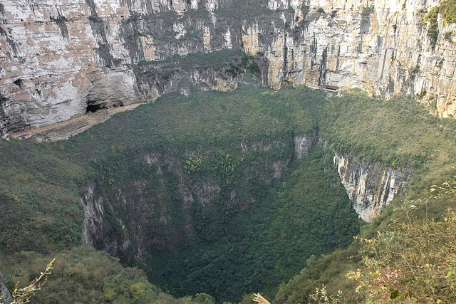 Geologists believe that the sinkhole was formed by the collapse of a massive cave system created by the erosive action of an underground river