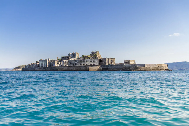 Hashima resembles a 20th-century battleship adrift in the sea, a fortress of concrete and history.