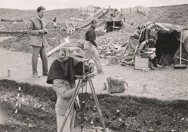 Sir Mortimer Wheeler (left) at work on the historic site of Maiden Castle in 1937, amidst one of the most memorable archaeological digs of his career.