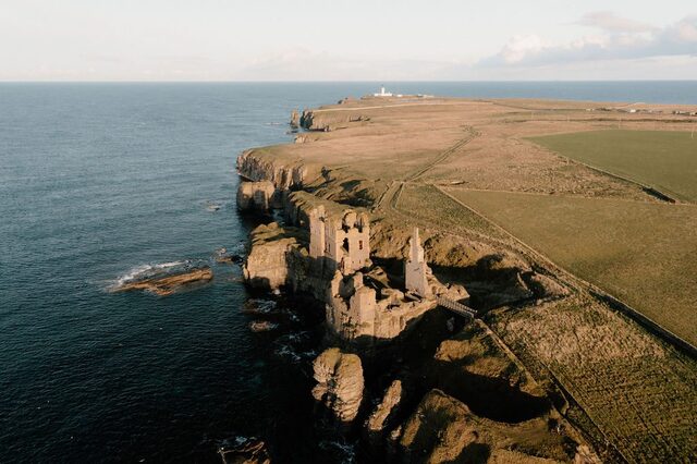 Surrounded by steep cliffs and jagged rocks, the castle appears almost inseparable from its environment