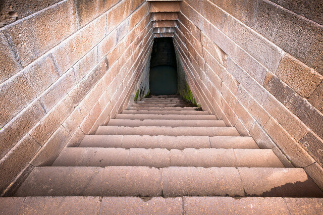 The entrance and stairs of the Well of Santa Cristina are crafted from perfectly squared stones with an extraordinary smooth finish.