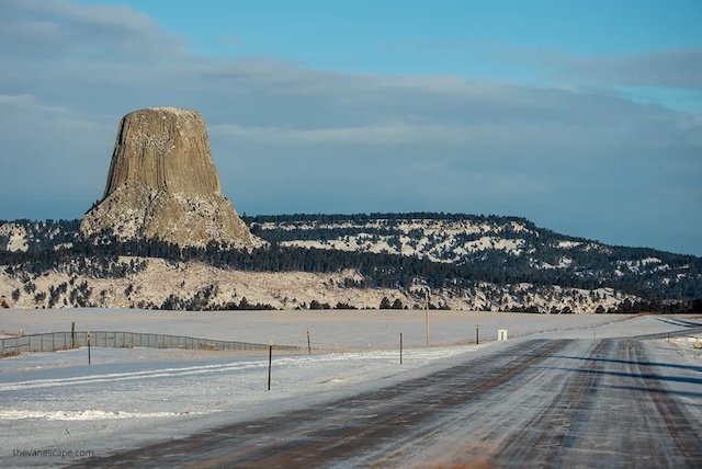 The striking monolith of Devils Tower rises out of the landscape, standing as America's first national monument and a site of immense geological and cultural significance