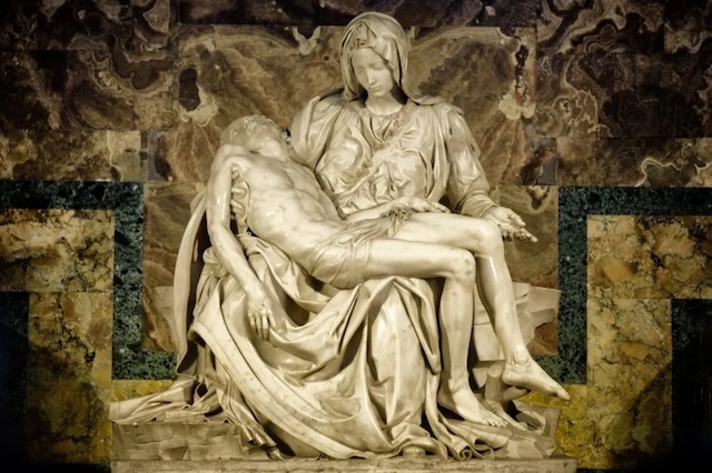 A stunning depiction of the Virgin Mary cradling the body of Jesus, carved from a single slab of Carrara marble, showcases the artist's unmatched mastery and emotional dept