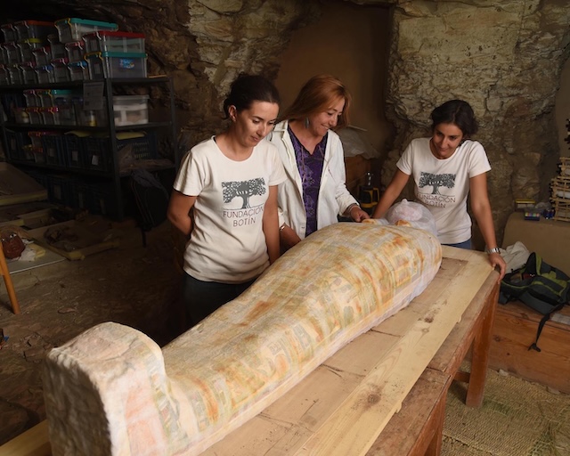  Archaeologists carefully examine the newly discovered sarcophagus of Amenrenef in a restoration workshop, preparing it for further study and conservation