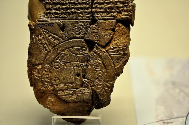 Close-up of the ancient clay tablet known as the Babylonian Map of the World, highlighting Babylon's central position.