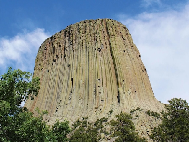 The towering columns of Devils Tower, formed by igneous rock, offer a testament to the unique geological processes that created this marvel