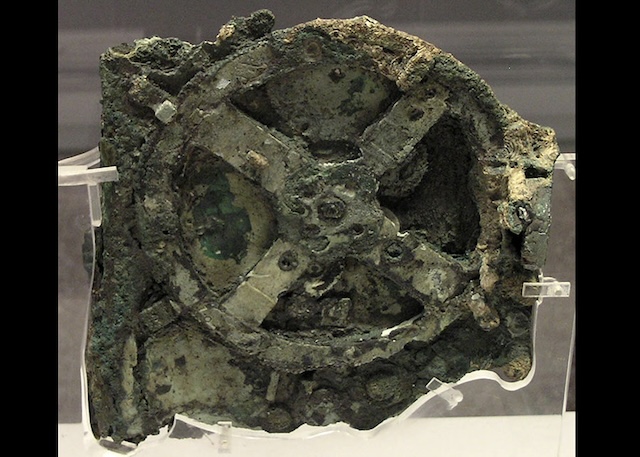 The original, corroded Antikythera Mechanism, discovered near the island of Antikythera, showing ancient Greek mechanical sophistication