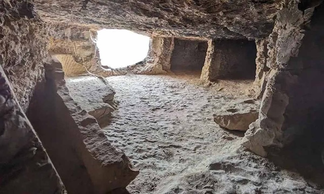 One of the uncovered tomb chambers within the 'City of the Dead,' offering a glimpse into the intricate burial sites built into the rock