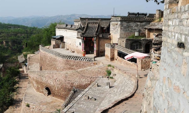 Modernized cave dwellings that blend historical architecture with contemporary living standards in China