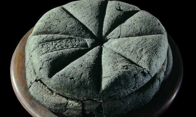 Carbonized loaf of 'Panis quadratus' bread, preserved for 2,000 years, providing a glimpse into the dietary habits of ancient Romans