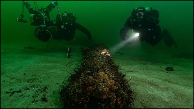 Divers explore the depths near the Cosquer Cave entrance, uncovering clues to prehistoric life submerged 37 meters below the Mediterranean Sea