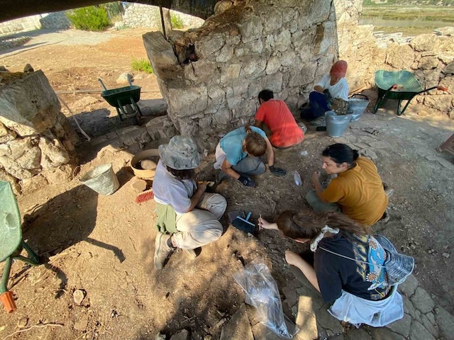 Archaeologists at work, unearthing the secrets of the past layer by layer