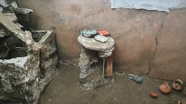 A simple room discovered in Pompeii, reflecting the daily life of middle-class citizens with its sparse furnishings and utilitarian objects