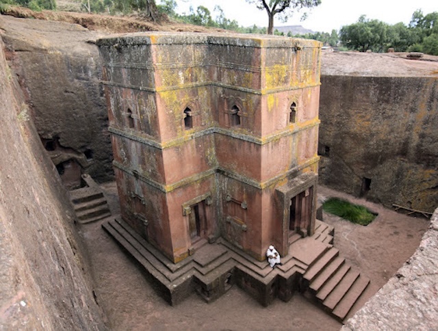 The Church of Saint George nestled within its carved pit, showing the staircases leading to the entrances of the structure