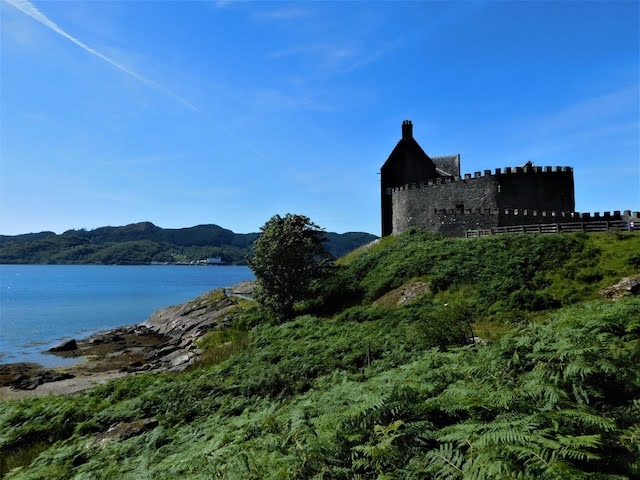 A bird’s-eye view of Duntrune Castle revealing its unique L-shaped structure and coastal location