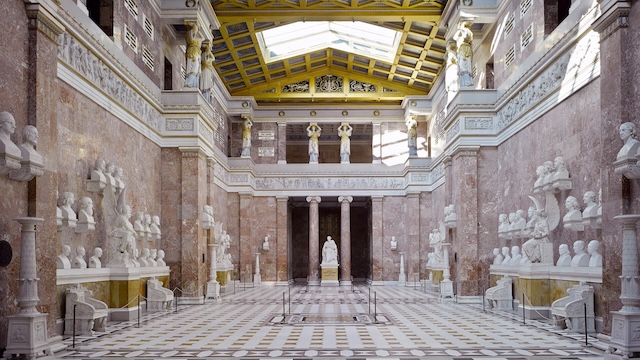 The grand interior of Walhalla, showcasing marble busts of German-speaking luminaries and a rich architectural design that radiates reverence and elegance