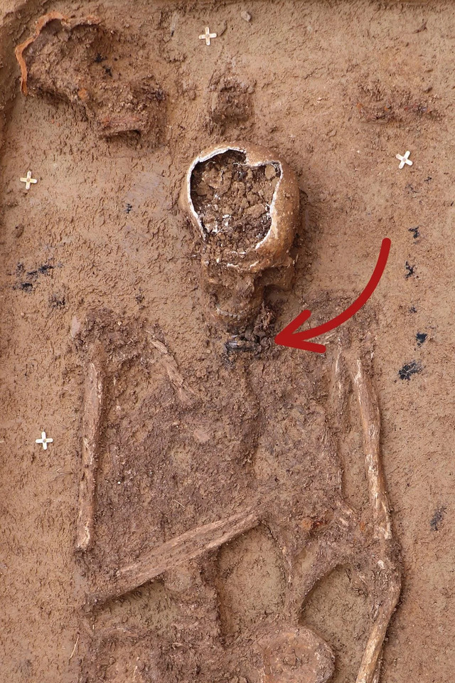 A 3rd-century burial featuring a silver amulet delicately placed at the neck.