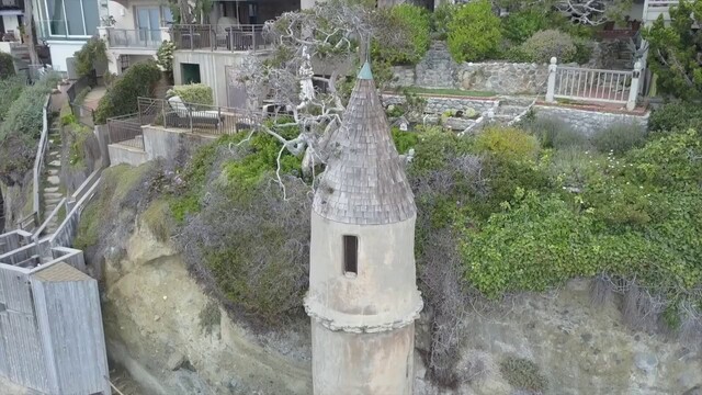 A bird's-eye view of La Tour's conical roof and its placement on the cliffside.