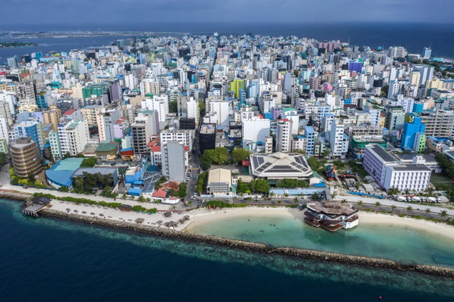 A bustling view of Male, the capital of the Maldives, highlighting the need for innovative solutions like the floating city.