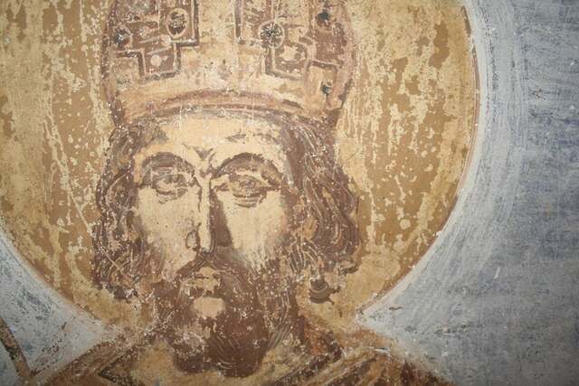 A close-up of Emperor Constantine XI Palaiologos' face from the fresco, revealing the delicate and individualized features that embody calmness and nobility, as described by experts.