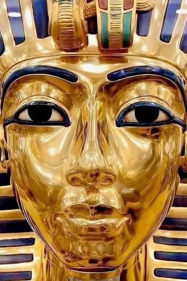 A close-up of King Tutankhamun's iconic golden funerary mask, showcasing its intricate craftsmanship and divine significance in ancient Egyptian culture.