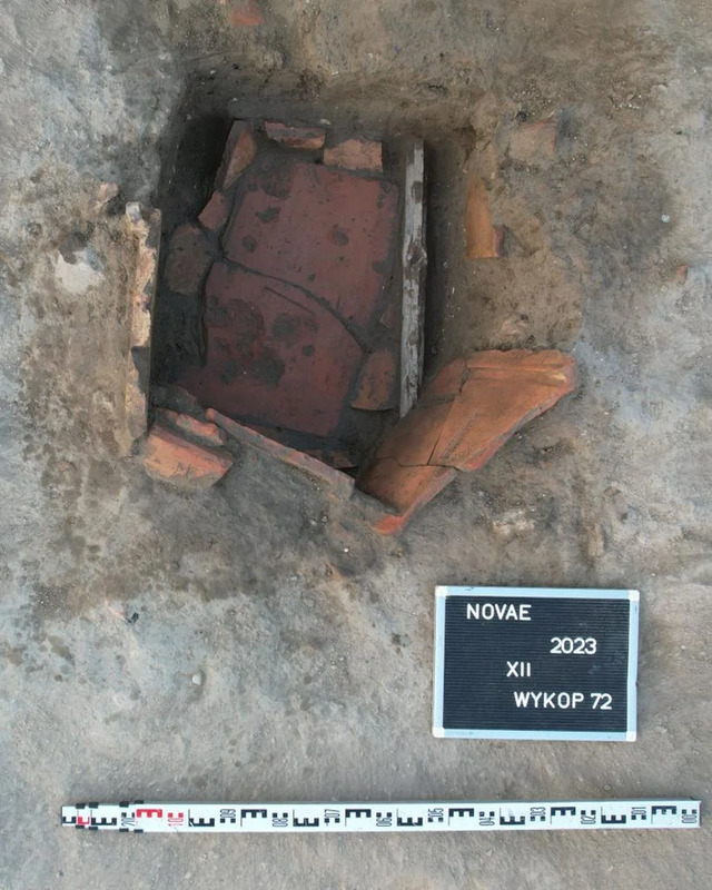 A close-up of the Roman refrigerator structure found at Novae, showcasing its ceramic plates and unique recessed design, used for food preservation. Credit: Krzysztof Narloch.