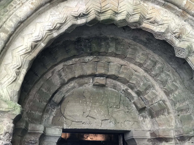 A close-up of the arch detailing, revealing centuries-old symbols and patterns that narrate Ireland’s vibrant past.