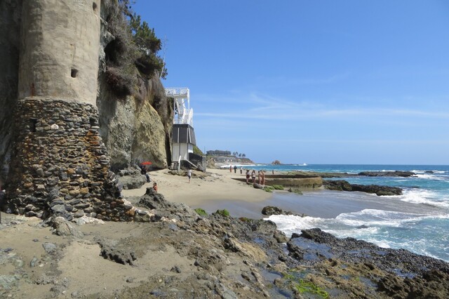 A closer look at La Tour and the neighboring beach, highlighting its integration into the natural landscape.