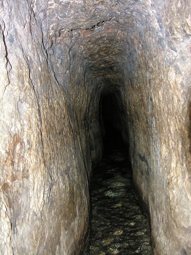 A closer look at the tunnel's interior, showcasing its smooth, water-bearing channels and the intricate craftsmanship of ancient workers.