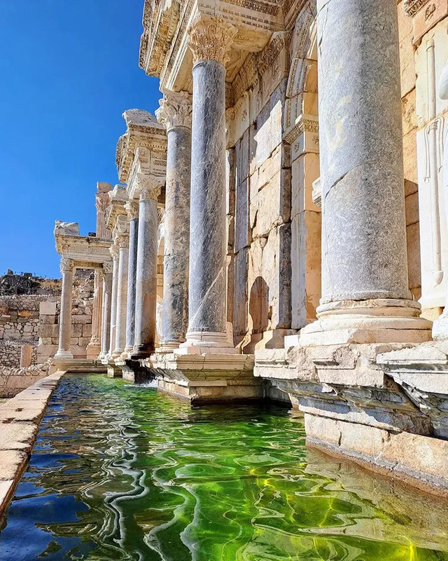 A closer view of the Antonine Nymphaeum, with its flowing waters and magnificent marble columns, a testament to Roman engineering