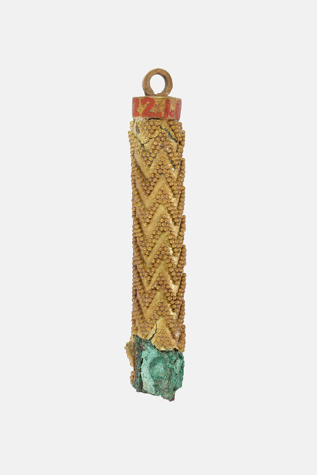 A cylindrical pendant displays the precision and attention to detail characteristic of Egypt's master goldsmiths.