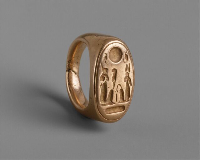 A finger ring depicting King Akhenaten and Queen Nefertiti as the deities Shu and Tefnut celebrates divine rulership and cosmic harmony.