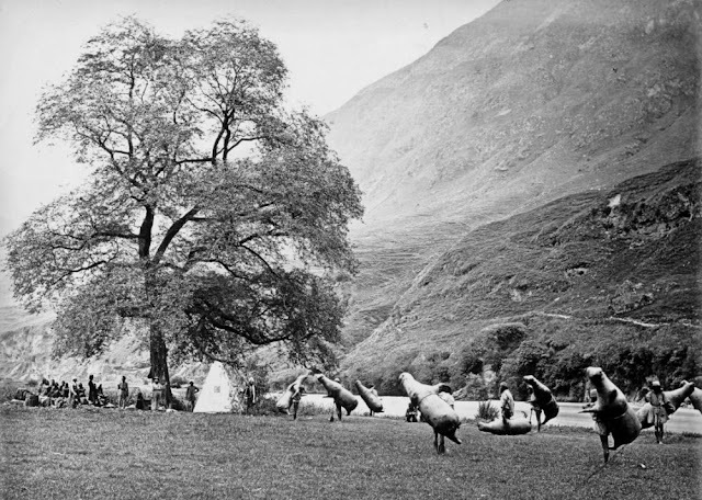 A gathering of locals and travelers near the riverbank, highlighting the community's dependence on the ingenious "drea" technology.