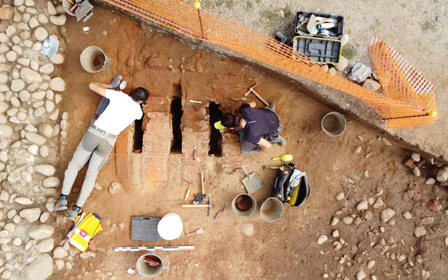 A historic kiln is meticulously excavated, shedding light on ancient craftsmanship.